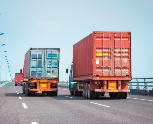 Side view of a container truck on the bridge